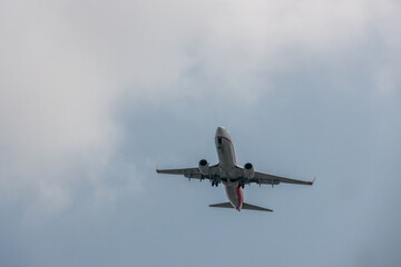 Commercial Aircraft Landing At Airport Under Summer Sun