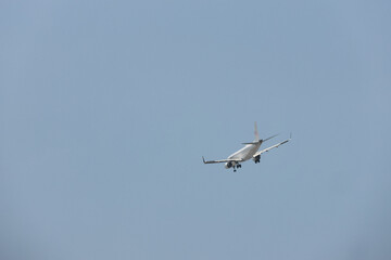 Commercial Jet Touching Down During Summer Noon