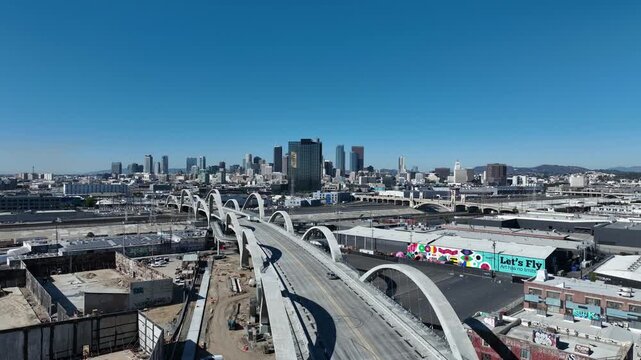 Overhead Drone View Across 6th Street Bridge, Downtown Los Angeles on March 5, 2025 - Showcasing High-Rises and Cultural Graffiti in the Vicinity of Arts District, Southern California DTLA
