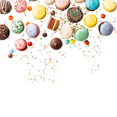 Colorful assortment of small, round candies and cookies cascading downwards