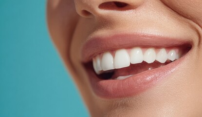 Fototapeta premium A radiant smile illuminates a close-up of a person's face showcasing healthy white teeth and a cheerful expression against a vibrant background.