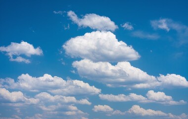 Obraz premium A blue sky with fluffy white clouds