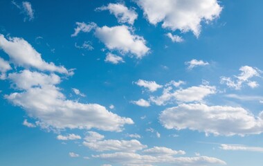 Naklejka premium A blue sky with fluffy white clouds