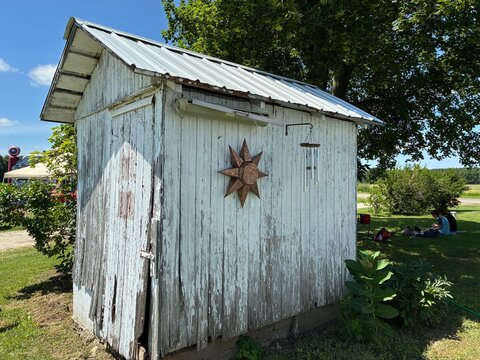 old wooden barn with sun at the farm