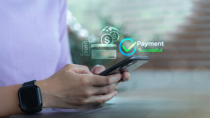 Person holding smartphone with payment successful message and finance icons, representing online...