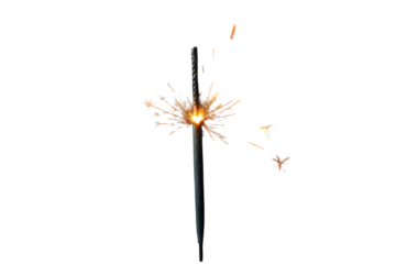 Single sparkler burning brightly with golden sparks on a black background festive celebration and holiday cheer isolated
