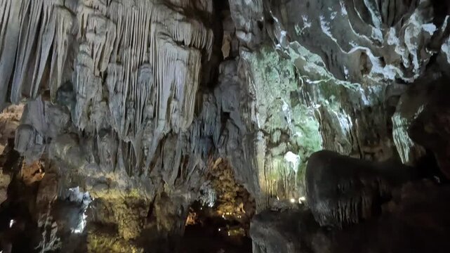 Intricate limestone formations and dramatic textures create a breathtaking underground landscape inside Thien Cung Cave, Ha Long Bay, Vietnam.