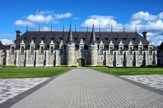 QUEBEC CITY QUEBEC CANADA 17 JUL 2025: The Voltigeurs de Qu&eacute;bec Armoury in Quebec City, a historic gothic revival military building with stone walls and turrets, under a blue sky.