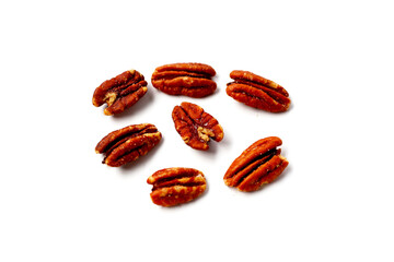 Delicious salted pecan nuts scattered.