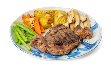 The High resolution photo of steak with potatoes, green beans and mushrooms using the focus stack technique.