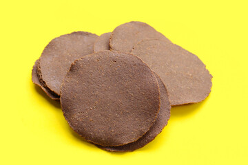 Fermented soybean discs, known as “Thua Nao,” a traditional Thai seasoning used to enhance flavor in Northern cuisine.