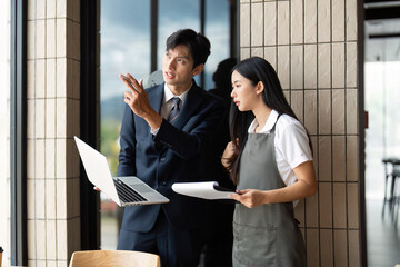 Strategic Planning. Businessman explaining ideas to a female employee in an office.