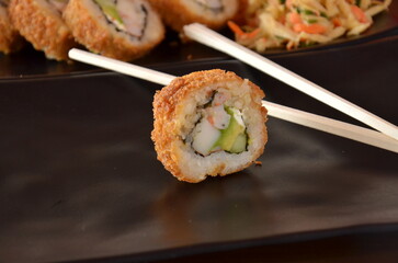 Delicious Japanese cuisine platter with sushi rolls, fried tofu and rice bowl for healthy eating