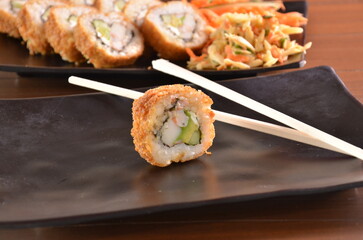 Delicious Japanese cuisine platter with sushi rolls, fried tofu and rice bowl for healthy eating