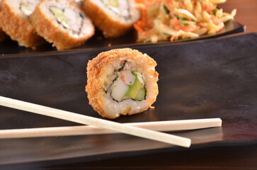 Delicious Japanese cuisine platter with sushi rolls, fried tofu and rice bowl for healthy eating