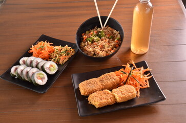 Delicious Japanese cuisine platter with sushi rolls, fried tofu and rice bowl for healthy eating