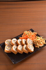 Delicious Japanese cuisine platter with sushi rolls, fried tofu and rice bowl for healthy eating