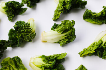 Fresh baby bok choy with crisp white green leaves.