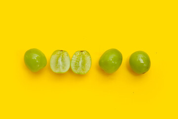 Shine muscat grape on yellow background.