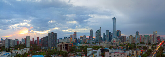 Naklejka premium Beijing CBD Skyline at Dusk - Panoramic View of China's Thriving Metropolis​