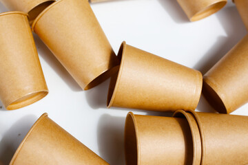 Brown paper cups on white background.