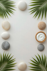 A minimalist spa flat with smooth spa stones, wooden bowls, and lush tropical leaves creates a natural, calming aesthetic with a balanced composition and negative space in the center.