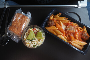 Meal served on a plane during a business trip