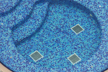 Relaxing hot tub experience with blue mosaic tiles