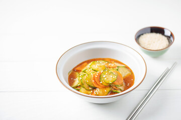 Cucumbers and carrots cut  circles in soy hot sauce. Asian cuisine.