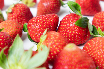 Close-up image of fresh, ripe strawberries with vibrant red hues,  juicy strawberries