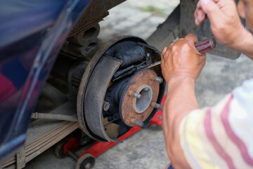 Auto Mechanic Working on Drum Brakes