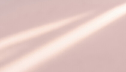 Light beams on a textured pink surface create a soft abstract pattern, blending warm tones and gentle motion for elegant visual layouts and contemporary design compositions.