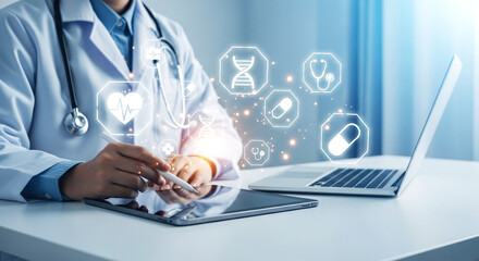 Doctor using tablet with medical icons and laptop on desk for healthcare technology concept view close up