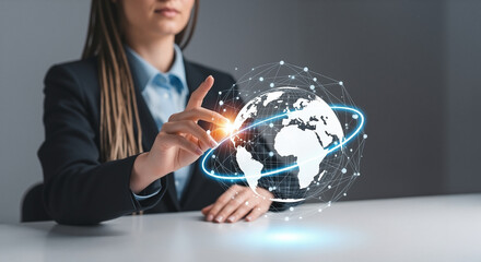 Businesswoman touching a futuristic holographic globe with a glowing global network, symbolizing international business and technology