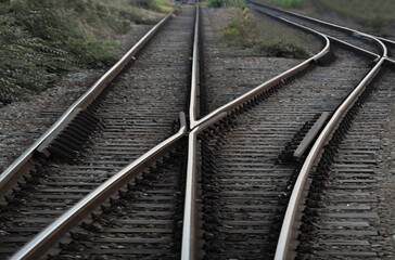 Railway junction. Perspective of crossing rails, traffic lights and train. Railway tracks, junction of tracks, perspective view. Pancevo bridge. Belgrade, Serbia.