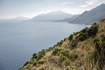 Beautiful coastal landscape with mountains and blue waters under a sunny sky