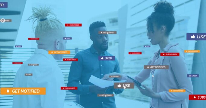 Colleagues tapping tablet initiating social media icons floating around team for marketing - Powered by Adobe