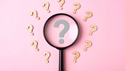 Magnifying glass revealing central question mark amid scattered marks on pink surface