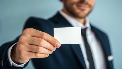 Business man holding blank business card mockup for contact information and networking presentation design