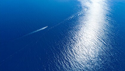 High-angle view of a vessel navigating a sunlit ocean