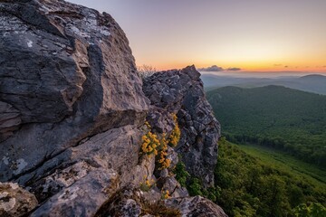 Sunset Mountain landscape with rocks, on top of mountain, sunlit hills, illuminated sky. Picturesque landscape Vysoka of Male (Little) Karpaty, Slovakia, Slovakia mountain range.