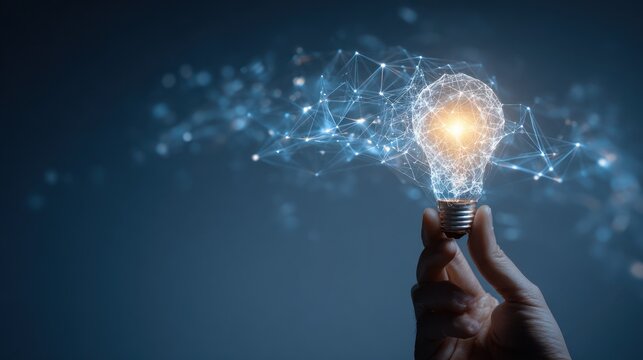 Hand holding lightbulb formed by glowing, interconnected lines & points