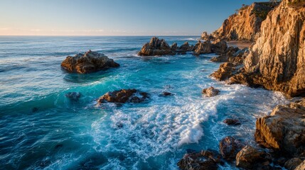 Crystal-clear seascape with waves crashing against rugged coastal cliffs at golden hour