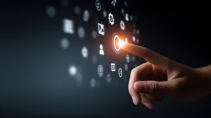 Finger touching glowing button on dark interface dotted with digital icons