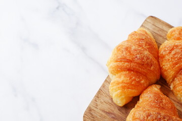 Croissants on a wooden board
