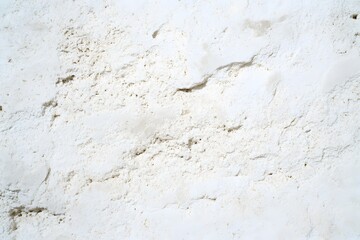 Raw limestone background with pale beige-white tones, soft grains, and a clean, minimal interior aesthetic.