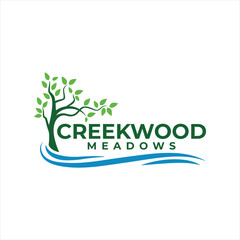 Creekwood Meadows Logo Featuring Green Tree Above Blue Creek Waves, Clean and Modern Design