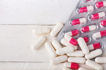 blister and capsules with medicines on a white background