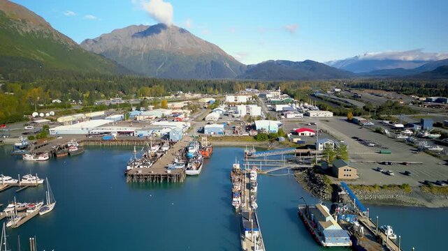 Aerial view of scenic Seward city and marina with many boats in autumn time