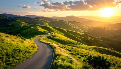 Winding road through sunlit hills at sunset